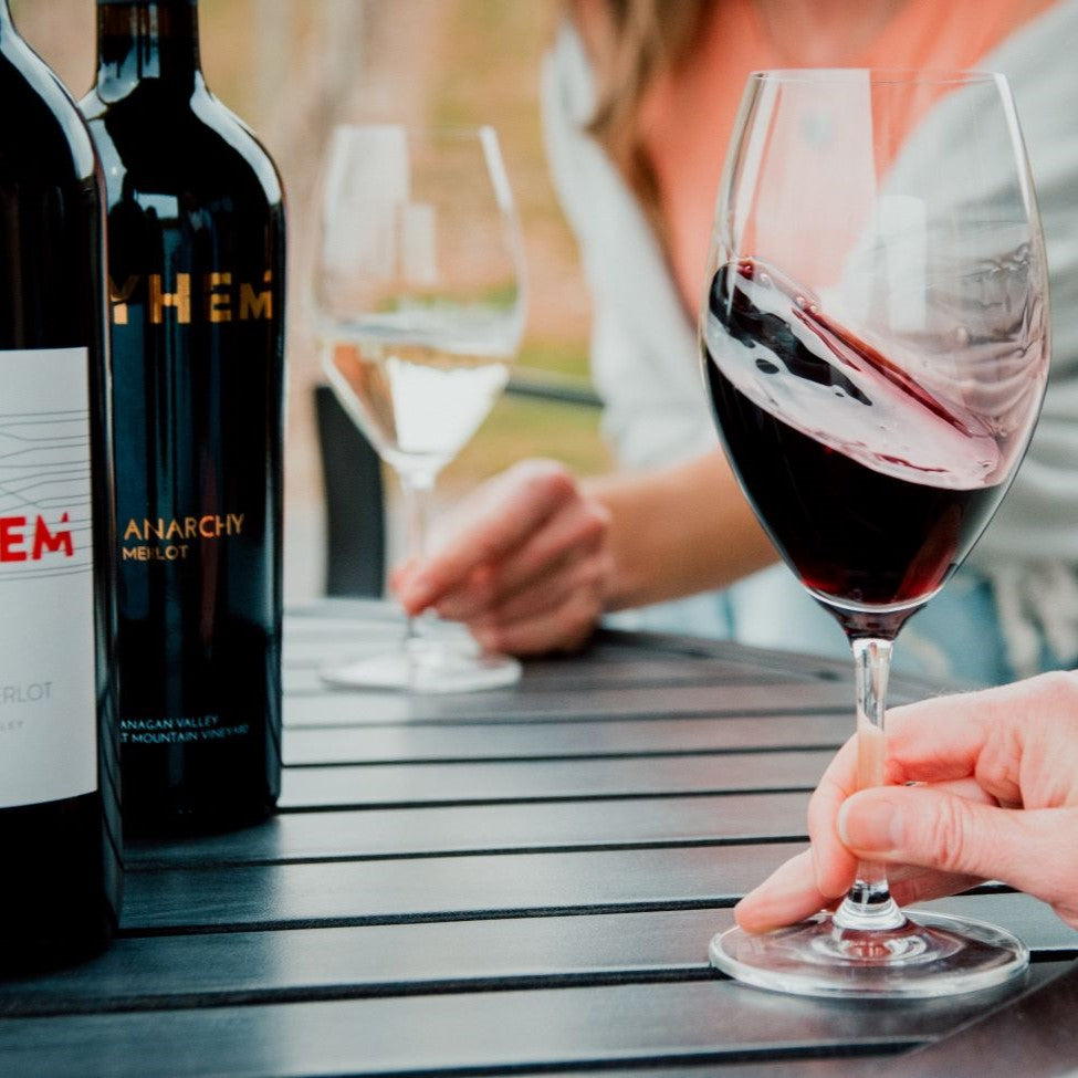 People drinking Merlot on the Mayhem patio